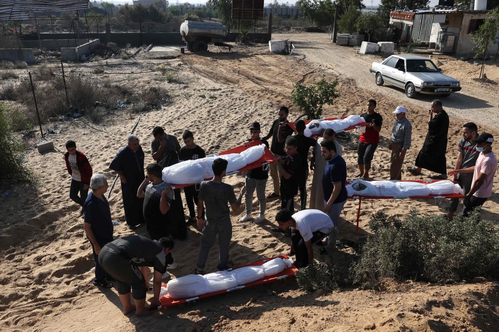 Talaat Barhom, attends the funeral of his wife and four of his children killed in Israeli bombardment, in Rafah in the southern Gaza Strip on Monday. Photo: AFP