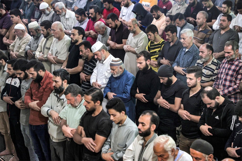 Muslim worshippers pray in the rebel-held town of al-Dana in Syria’s northwestern Idlib province. Mainly Muslim Syria is deeply conservative. Photo: AFP