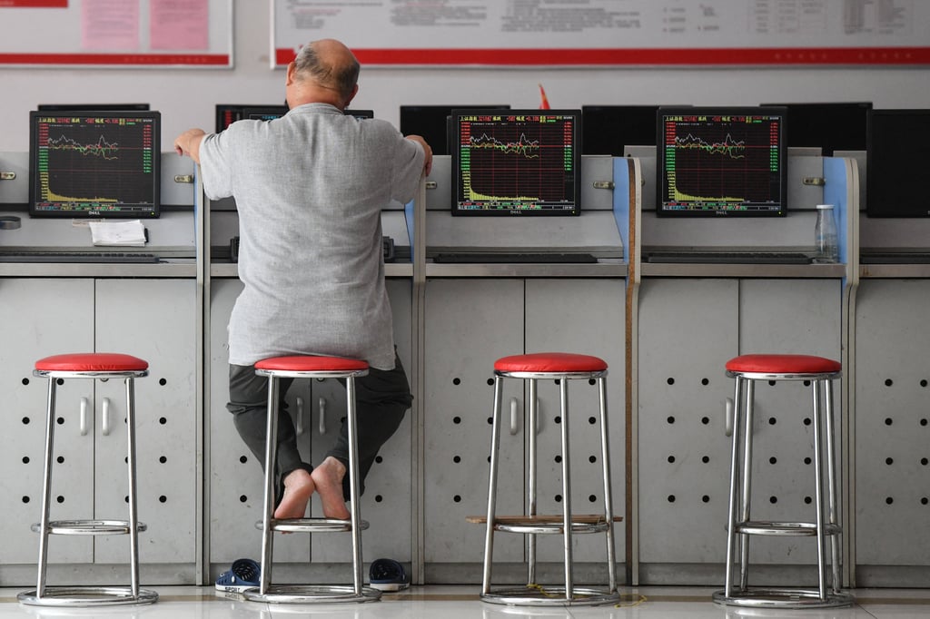 An investor looks at screens showing stock market movements at a securities company in Fuyang in China’s eastern Anhui province on May 29, 2023. Photo: AFP An investor looks at screens showing stock market movements at a securities company in Fuyang in China’s eastern Anhui province on May 29, 2023. Photo: AFP