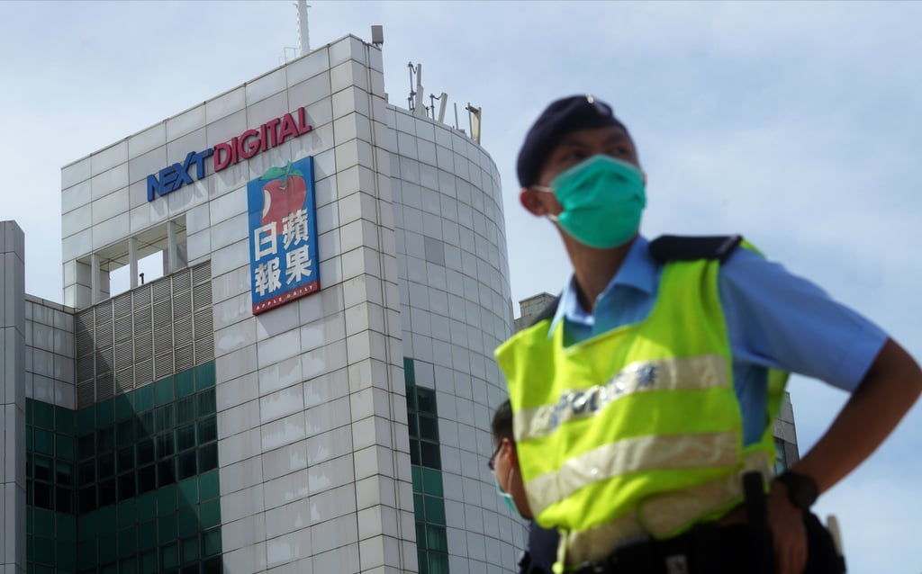 A police officer stands guard as colleagues raid the offices of Jimmy Lai’s Apple Daily newspaper in 2020. Photo: Winson Wong A police officer stands guard as colleagues raid the offices of Jimmy Lai’s Apple Daily newspaper in 2020. Photo: Winson Wong