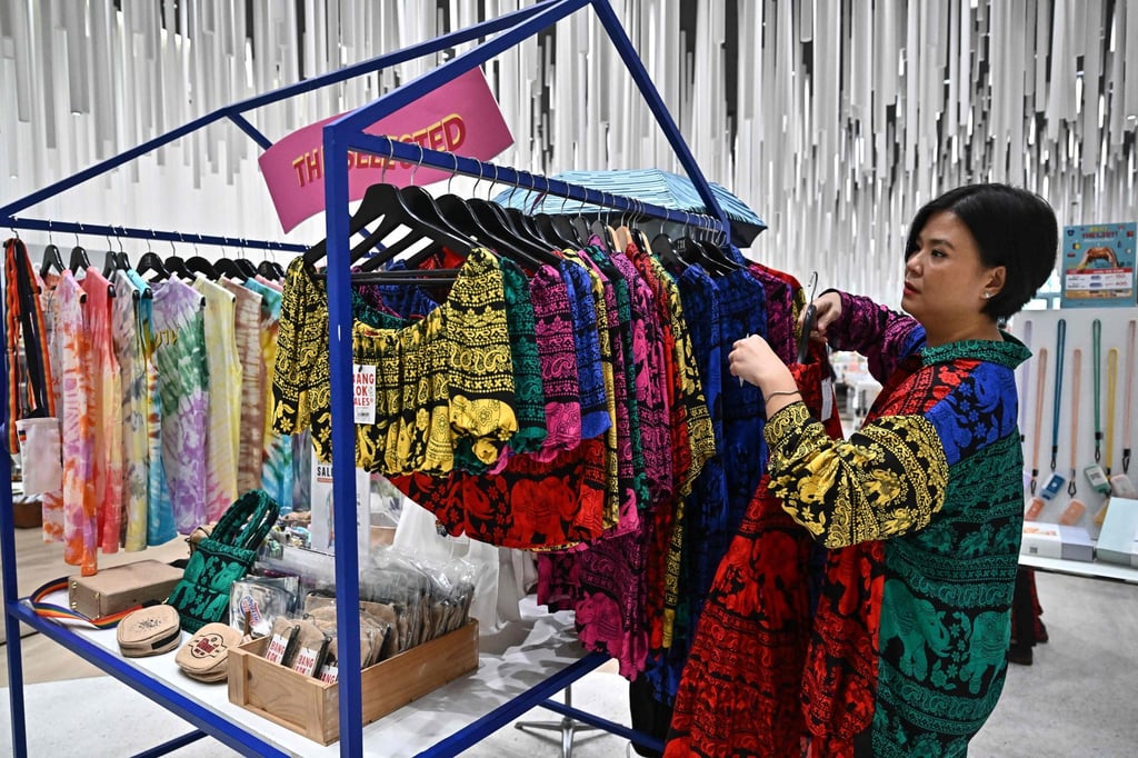 A Thai clothes designer shows her items at Icon Siam shopping mall in Bangkok. Photo: AFP A Thai clothes designer shows her items at Icon Siam shopping mall in Bangkok. Photo: AFP