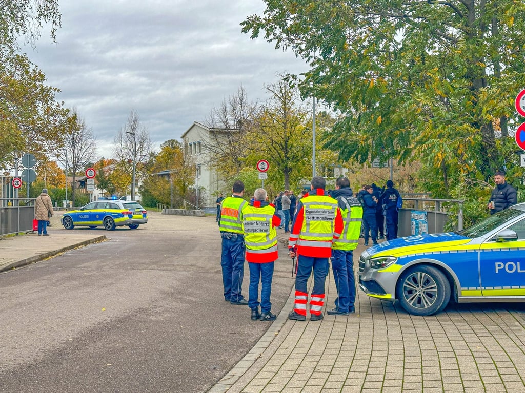 Police officers are seen near the scene of a school shooting in Offenburg, Germany on Thursday. Photo: dpa