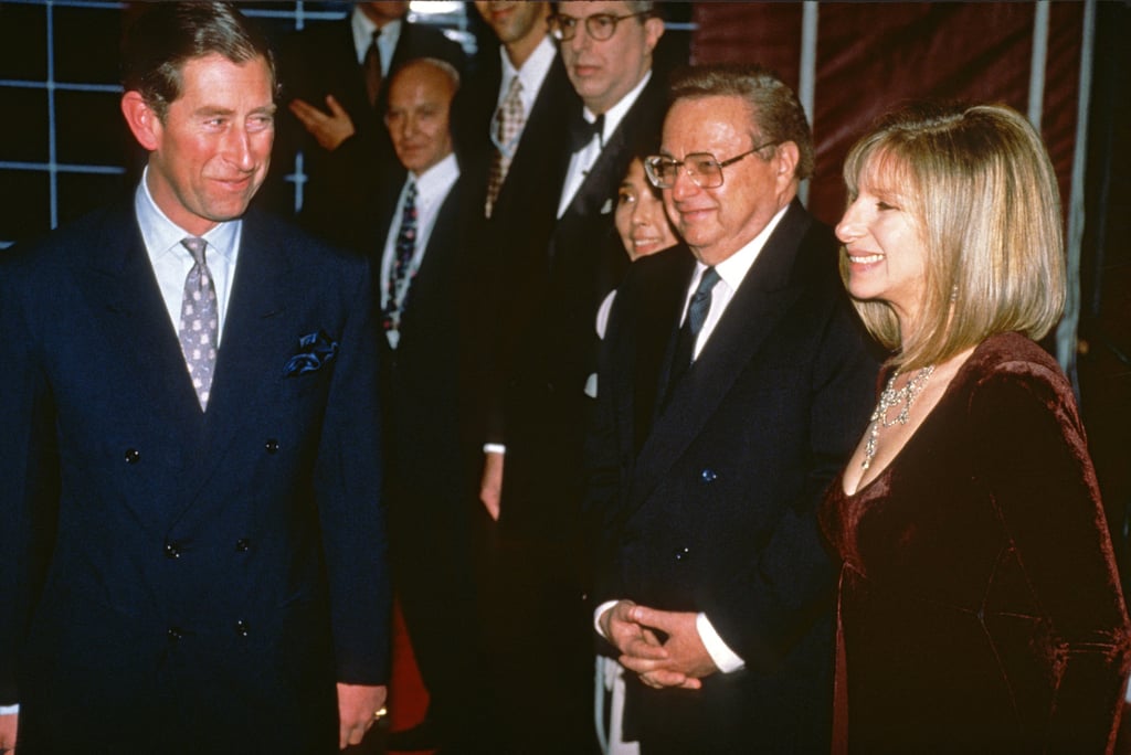 Then Prince Charles, Prince of Wales smiles as he meets Barbra Streisand (right) and others backstage during a champagne reception ahead of a gala performance in aid of The Prince’s Trust at Wembley Arena in London, UK, in 1994. Photo: Getty Images