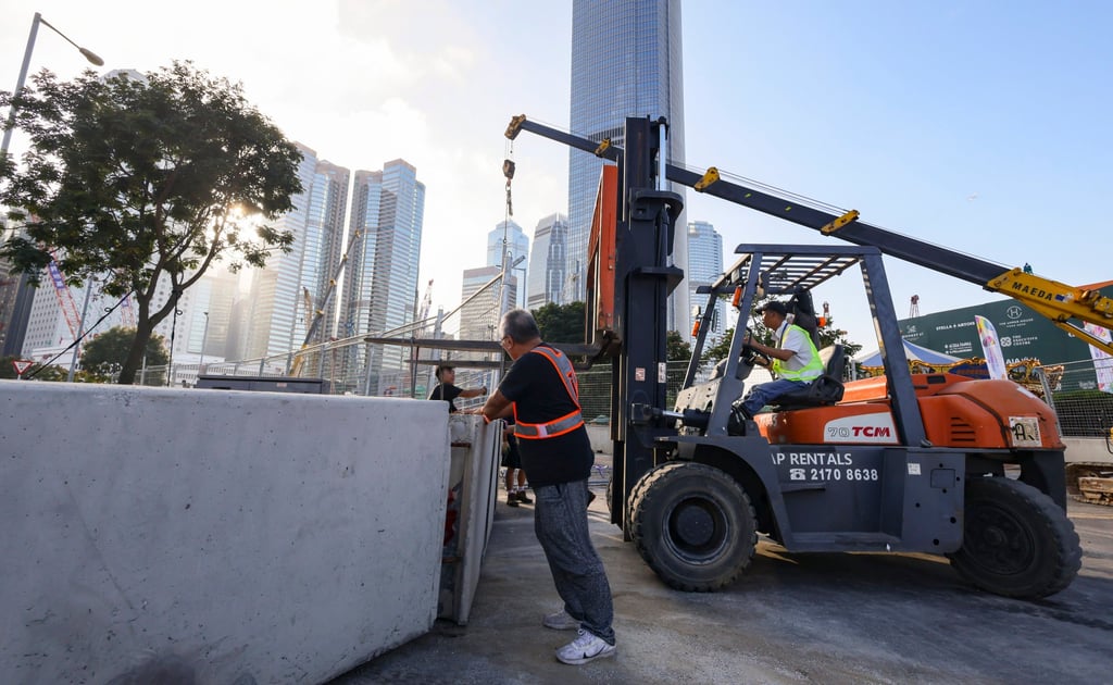 The concrete barriers and gravel required for the two straights on Lung Wo Road did not arrive from South Korea until late on Friday night. Photo: Dickson Lee