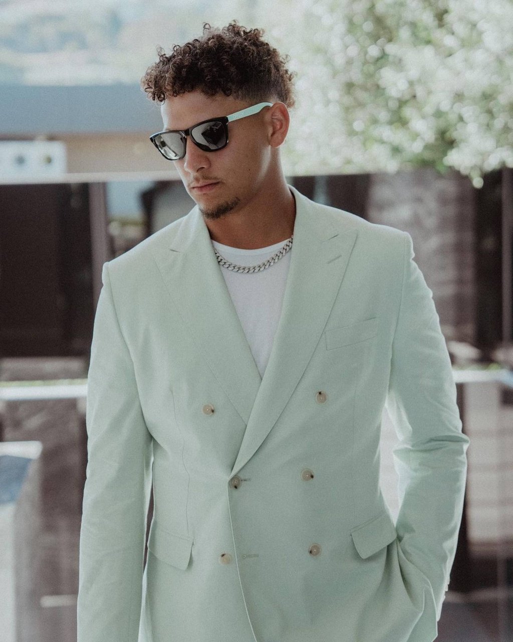 Patrick Mahomes showing off a mint Boss suit with matching Oakley sunglasses. Photo: @patrickmahomes/Instagram