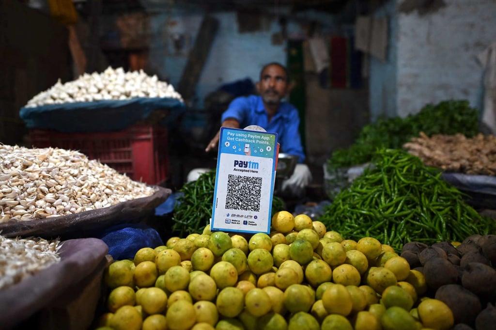 A vegetable vendor waits for customers displaying a bar code for Paytm, an Indian mobile-phone-based digital payment platform, at a market in New Delhi. Photo: AFP A vegetable vendor waits for customers displaying a bar code for Paytm, an Indian mobile-phone-based digital payment platform, at a market in New Delhi. Photo: AFP