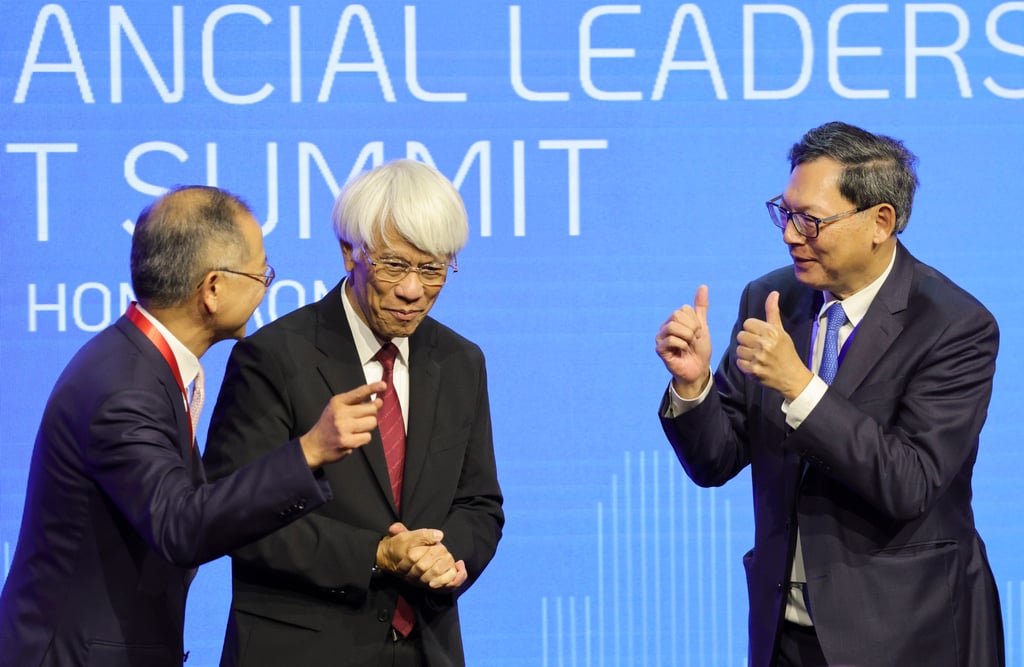 From Left to right – Eddie Yue Wai-man, CEO of Hong Kong Monetary Authority, speaks with first CEO and founder of the HKMA, Joseph Yam Chi-kwong (middle) and second CEO Norman Chan Tak-lam (right). Photo: May Tse