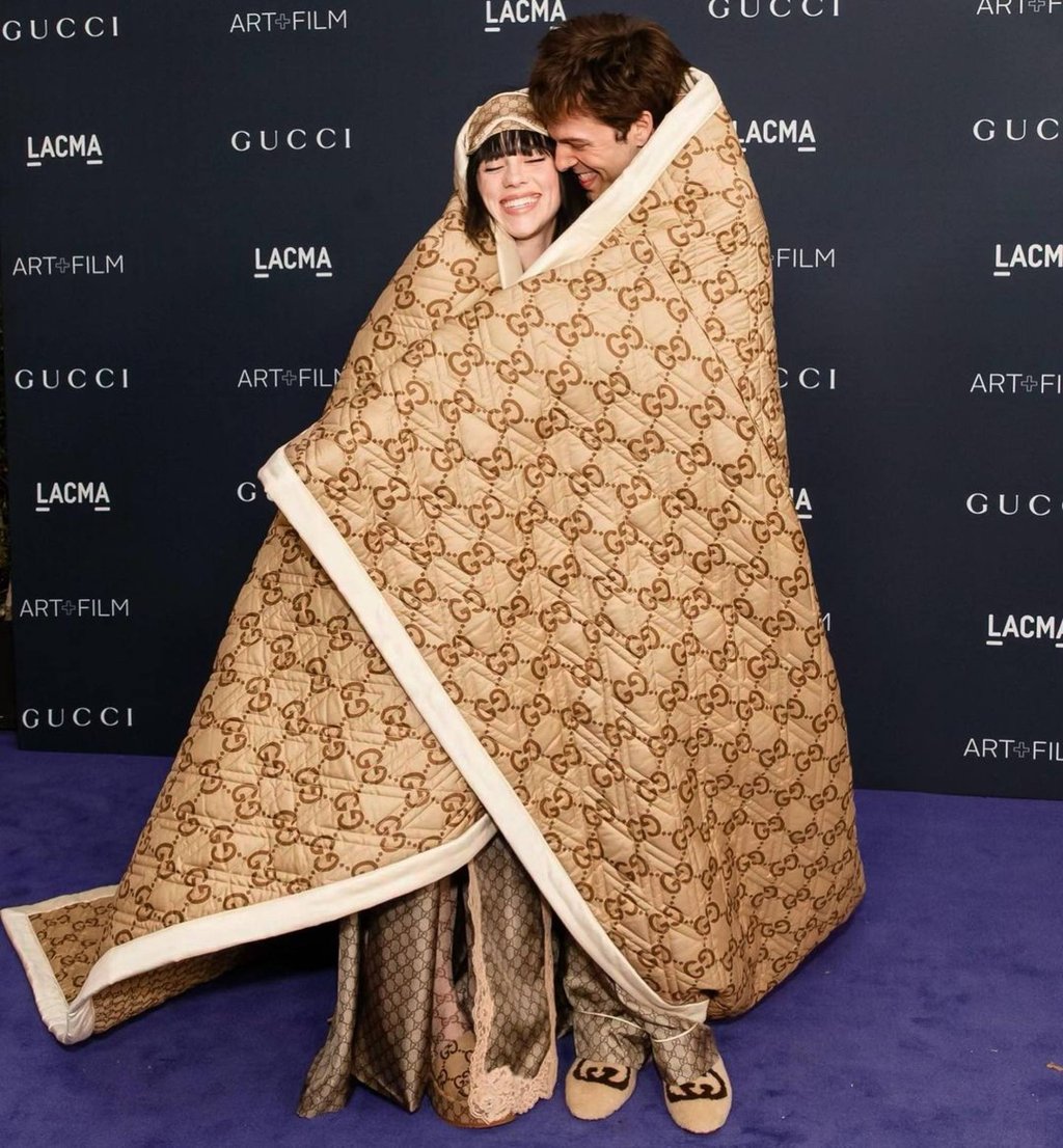 Billie Eilish – pictured with her then boyfriend Jesse Rutherford attending the Lacma Art + Film gala in Gucci pyjamas, in November 2022 – just revealed she has a complicated relationship with femininity. Photo: @billieeilish/Instagram