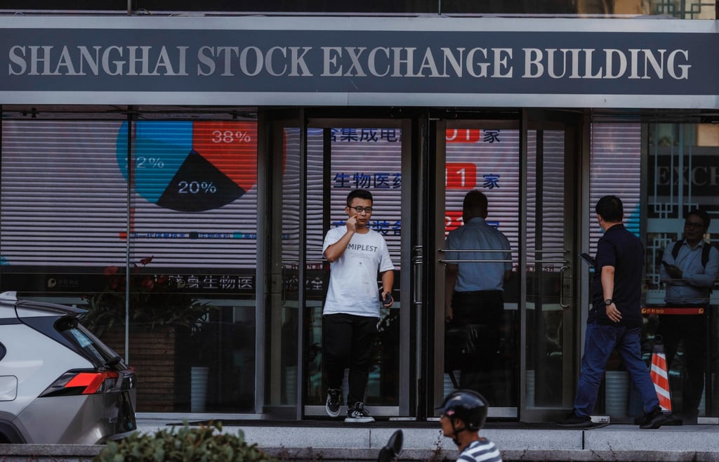 People walk past the Shanghai Stock Exchange building in Shanghai, China. Photo: EPA-EFE People walk past the Shanghai Stock Exchange building in Shanghai, China. Photo: EPA-EFE