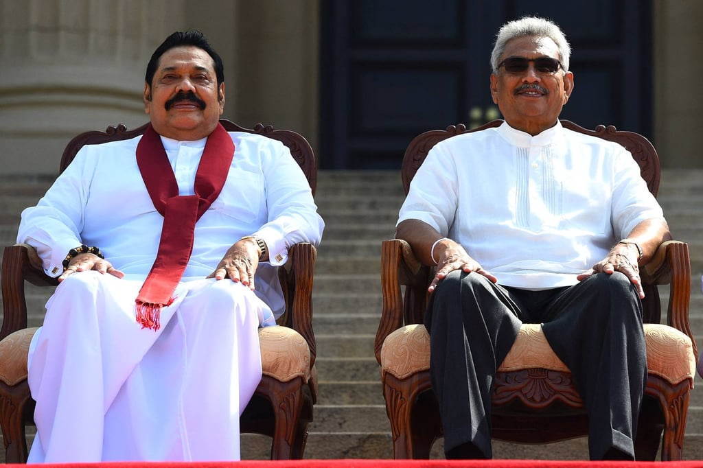 Former president Gotabaya Rajapaksa (right) and his brother, former prime minister Mahinda Rajapaksa, pose for a group photograph after the ministerial swearing-in ceremony in Colombo in 2019. Photo: AFP