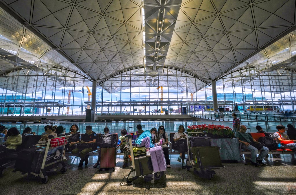 Passengers in the arrival hall of Hong Kong airport on July 6. Photo: Elson Li