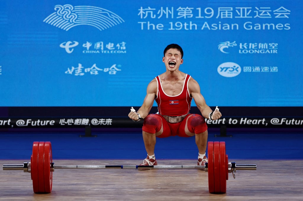 North Korea’s Ri Wonju reacts after a successful lift at the 67Kg weightlifting Group A competition at the Asian Games. Photo: Reuters North Korea’s Ri Wonju reacts after a successful lift at the 67Kg weightlifting Group A competition at the Asian Games. Photo: Reuters