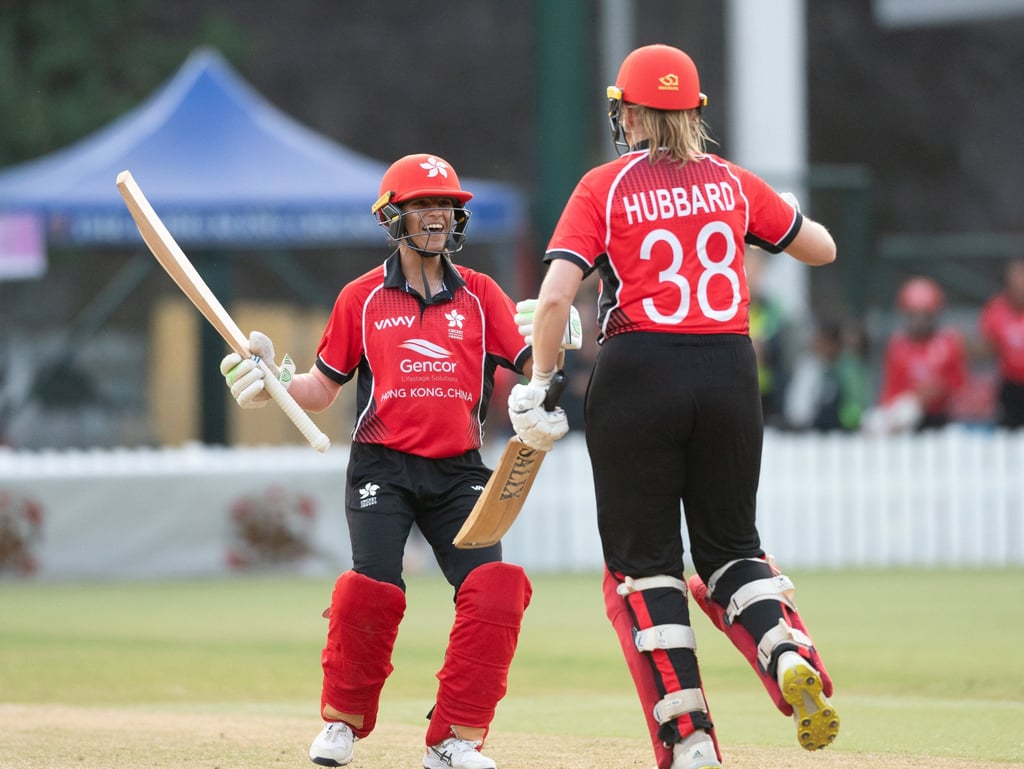 Maryam Bibi and Elysa Hubbard celebrate after guiding Hong Kong to victory over Tanzania.