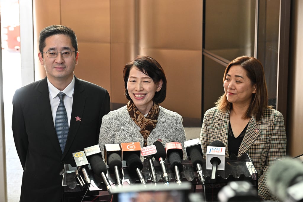 (Left to right) Commerce undersecretary Bernard Chan, Chief Executive’s Office director Carol Yip, as well as Denise Hung, political assistant to Hong Kong’s justice minister, speak to the press before setting off for mainland China. Photo: Handout (Left to right) Commerce undersecretary Bernard Chan, Chief Executive’s Office director Carol Yip, as well as Denise Hung, political assistant to Hong Kong’s justice minister, speak to the press before setting off for mainland China. Photo: Handout