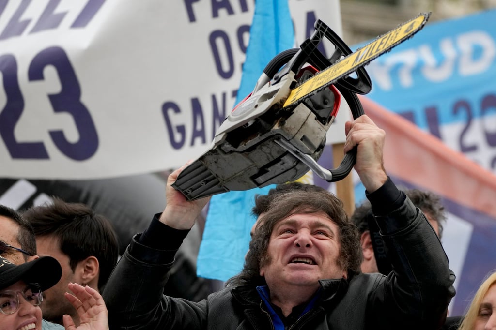 Javier Milei brandishes a chainsaw during a campaign event in September. Photo: AP Javier Milei brandishes a chainsaw during a campaign event in September. Photo: AP