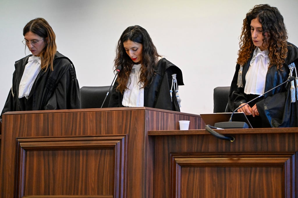 President of the court judge Brigida Cavasino, centre, flanked by judges Claudia Caputo, left, and Germana Radice reads the verdicts of a maxi-trial of hundreds of people accused of membership in Italy’s ‘ndrangheta organised crime syndicate. Photo: AP President of the court judge Brigida Cavasino, centre, flanked by judges Claudia Caputo, left, and Germana Radice reads the verdicts of a maxi-trial of hundreds of people accused of membership in Italy’s ‘ndrangheta organised crime syndicate. Photo: AP
