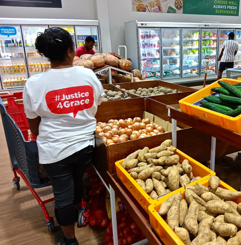 A local employee at a Grace Road Group supermarket. Photo: Kalinga Seneviratne