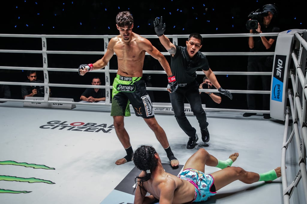 Elias Mahmoudi stands over Edgar Tabares after knocking him down. Photo: ONE Championship