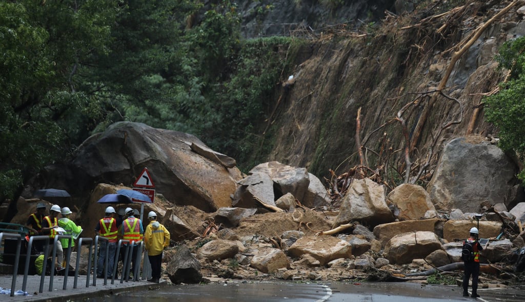 Workers assess a landslide that blocked a section of Yiu Hing Road in Shau Kei Wan, Hong Kong, on September 9, 2023. Photo: Xiaomei Chen