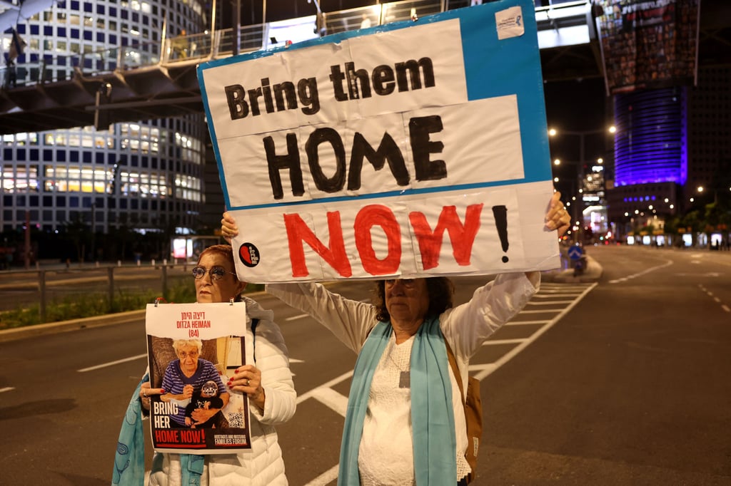 Families of Israeli hostages held by Palestinian militants in the Gaza Strip protest in Tel Aviv before a pause in the conflict for a swap of prisoners was announced. Photo: TNS Families of Israeli hostages held by Palestinian militants in the Gaza Strip protest in Tel Aviv before a pause in the conflict for a swap of prisoners was announced. Photo: TNS