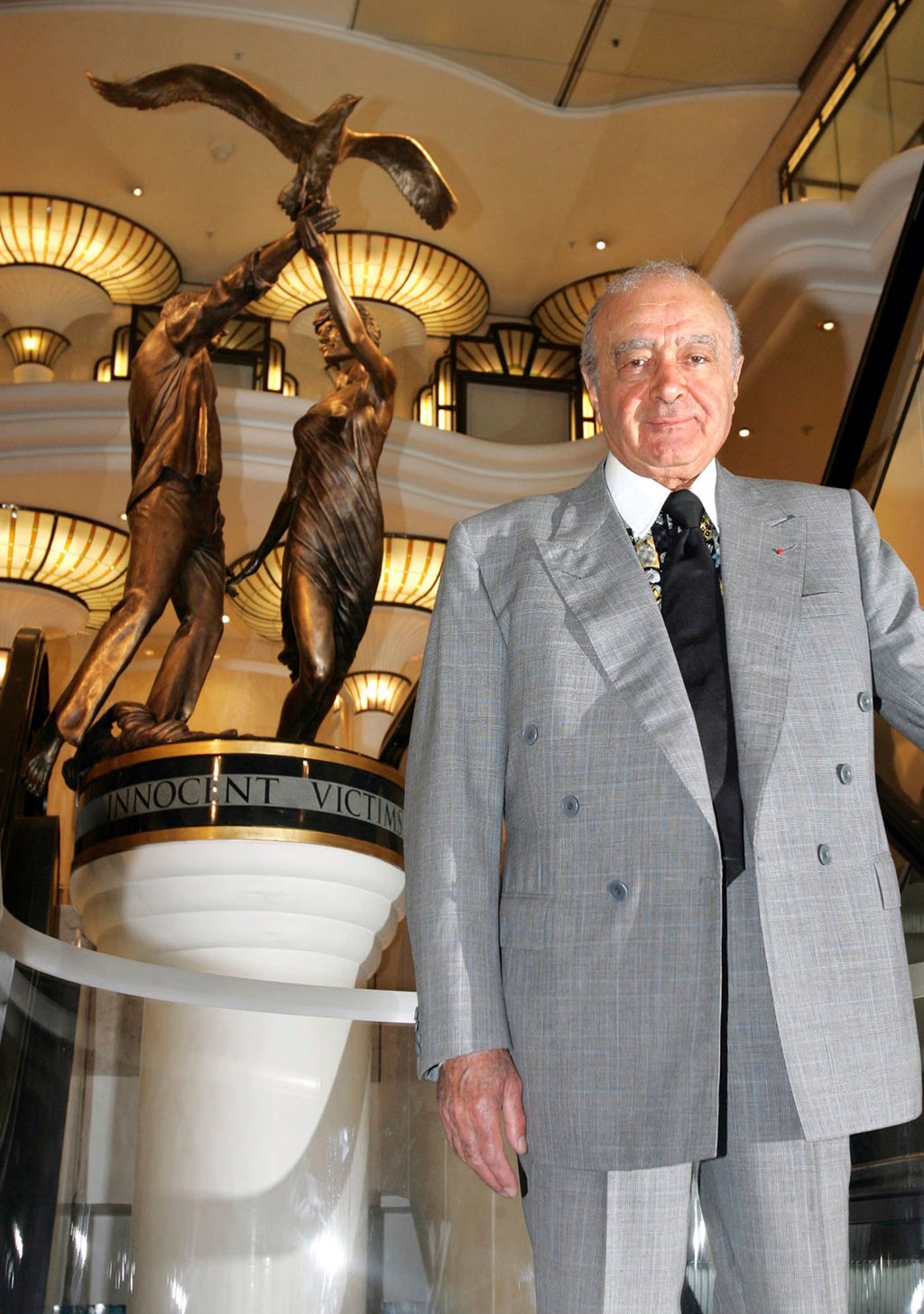 Harrods chairman Mohamed Al-Fayed unveils a new memorial statue, seen in background, on the eighth anniversary of the deaths of his son Dodi and Diana, Princess of Wales at Harrods department store in London, in 2005. Photo: AP Photo Harrods chairman Mohamed Al-Fayed unveils a new memorial statue, seen in background, on the eighth anniversary of the deaths of his son Dodi and Diana, Princess of Wales at Harrods department store in London, in 2005. Photo: AP Photo