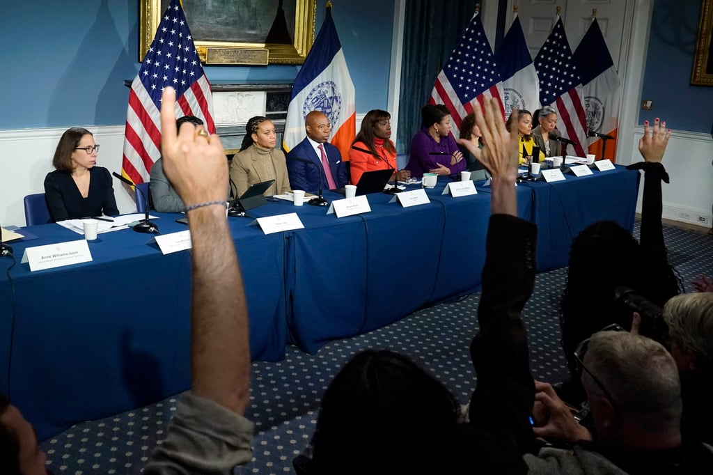 Reporters raise their hands to ask New York Mayor Eric Adams (centre) questions during a news conference at New York’s City Hall on November 14. Photo: AP