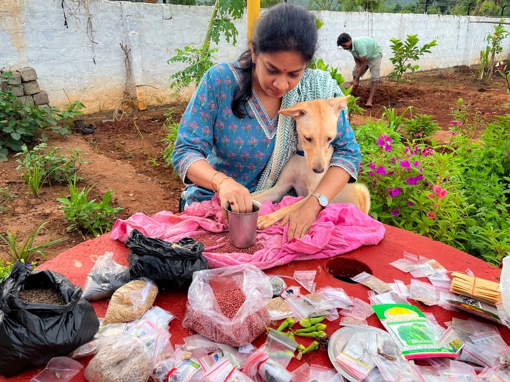 Madhavi Guttikonda works in a yard, alongside her dog. Photo: Handout
