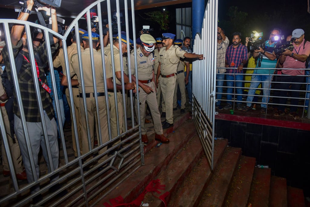 A police officer inspects the spot of the stampede at the venue. Photo: AP