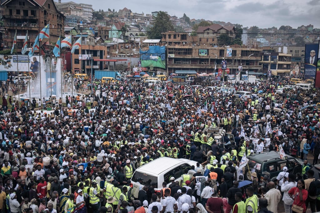Supporters of Congolese doctor and presidential candidate Denis Mukwege surround his car as he leaves after a campaign rally in Bukavu, capital of South Kivu province, in the eastern Democratic Republic of Congo on Saturday. Photo: AFP