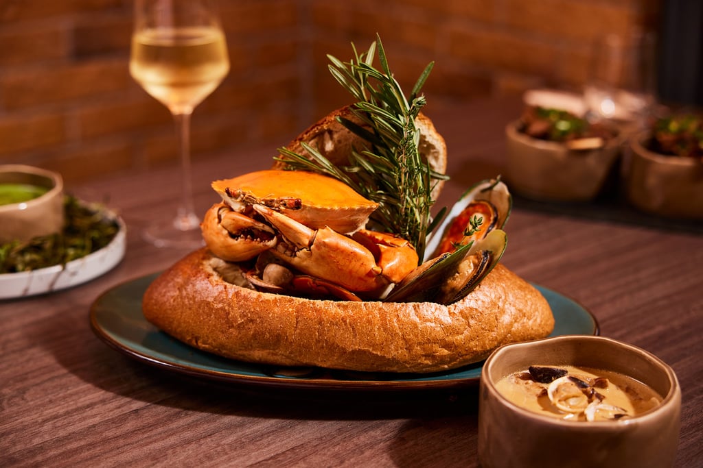 One of the restaurant’s signature recipes is whole baked crab in cream sauce, served with porcini mushrooms in a bread bowl. One of the restaurant’s signature recipes is whole baked crab in cream sauce, served with porcini mushrooms in a bread bowl.