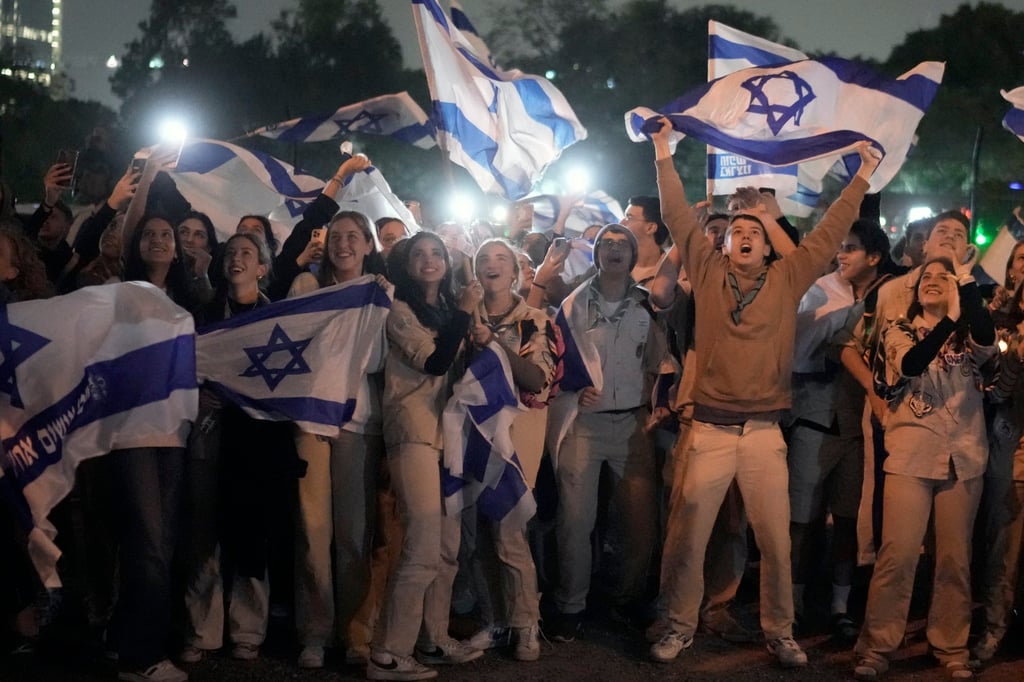Israelis celebrate as a helicopter carrying hostages lands at Schneider Children’s Medical Centre in Petah Tikva, Israel. Photo: AP