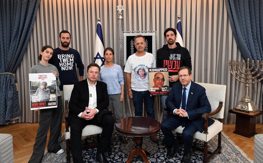 Israeli President Isaac Herzog and Elon Musk with representatives of families of hostages held by Hamas. Photo: Haim Zach/GPO/dpa