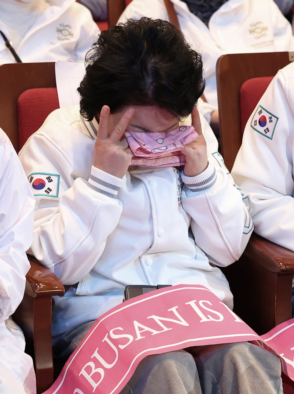 A South Korean supporter weeps in Busan on Wednesday after the city failed to win the right to host the 2030 World Expo. Photo: Yonhap via AP A South Korean supporter weeps in Busan on Wednesday after the city failed to win the right to host the 2030 World Expo. Photo: Yonhap via AP