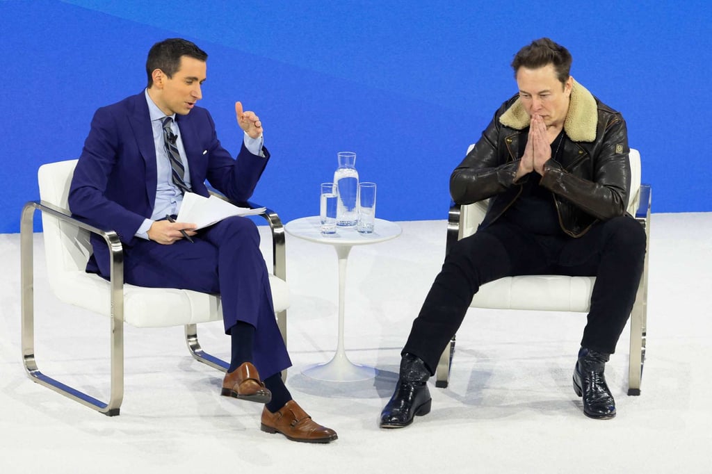New York Times columnist Andrew Sorkin and Elon Musk at the DealBook Summit. Photo: AFP New York Times columnist Andrew Sorkin and Elon Musk at the DealBook Summit. Photo: AFP