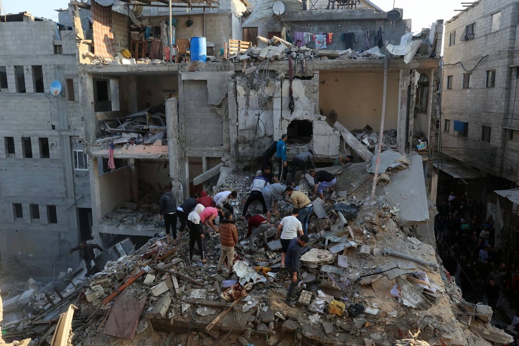 The aftermath of Israeli air strikes in the Rafah refugee camp in southern Gaza on Friday. Photo: AFP The aftermath of Israeli air strikes in the Rafah refugee camp in southern Gaza on Friday. Photo: AFP