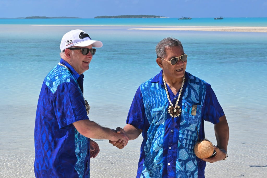 Australia’s Prime Minister Anthony Albanese (left) and Tuvalu’s Prime Minister Kausea shake hands on One Foot Island during the Pacific Islands Forum in Aitutaki, Cook Islands, on November 9. Photo: AP