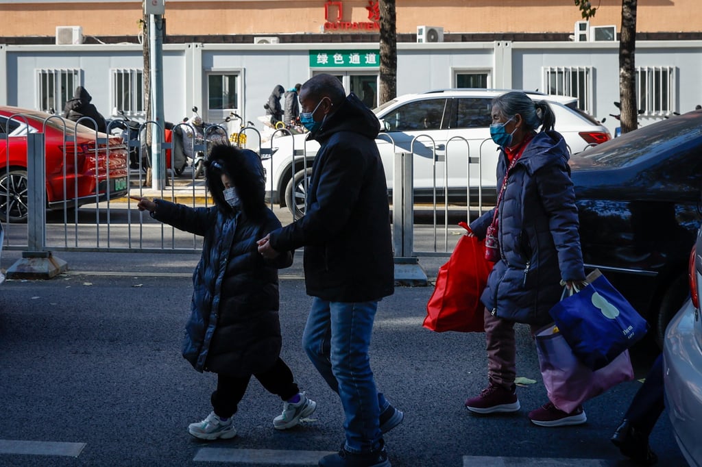 People walk outside a public children’s hospital in Beijing on Monday. Photo: EPA-EFE People walk outside a public children’s hospital in Beijing on Monday. Photo: EPA-EFE