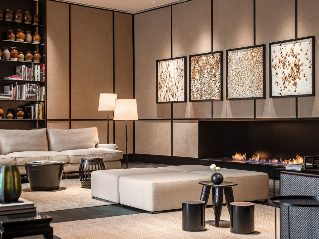 The lobby of The Middle House in Shanghai features artworks, a library and a fireplace The lobby of The Middle House in Shanghai features artworks, a library and a fireplace
