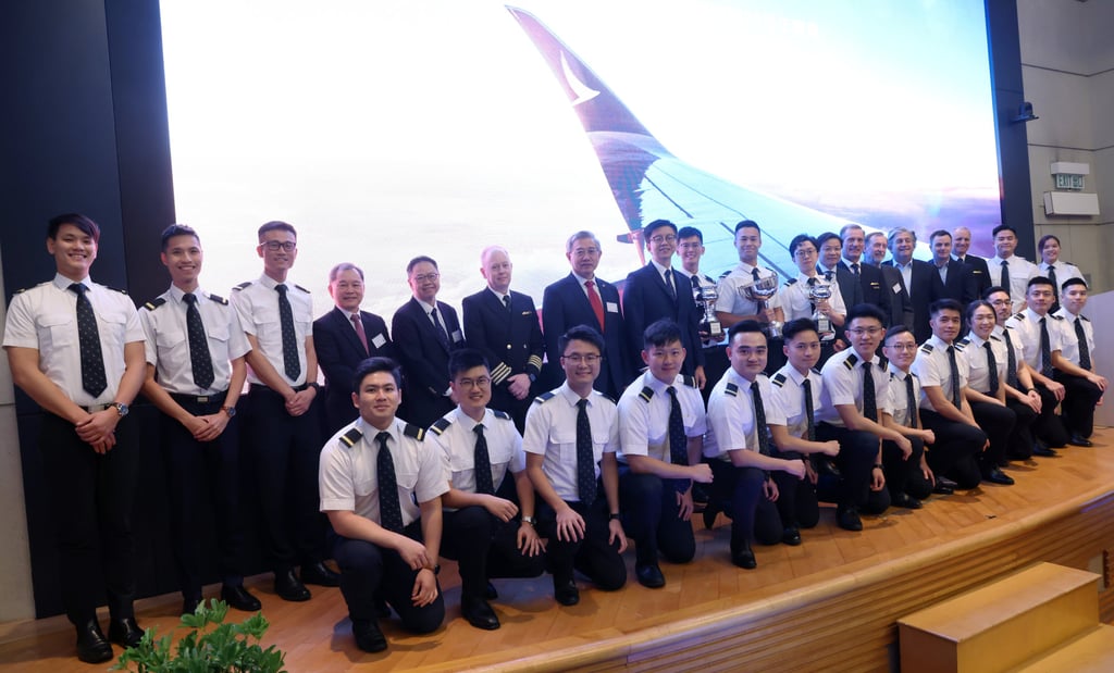 The graduates join Cathay bosses for a group photo. Photo: Yik Yeung-man