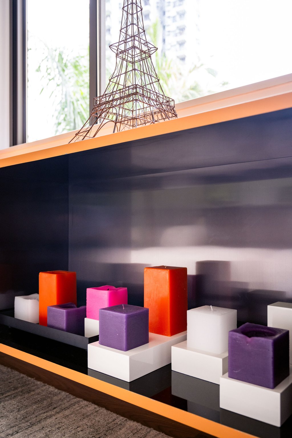 Hung designed the apricot linear unit that stretches from the entrance across the dining area to the living room. Stylist: Flavia Markovits. Photo: Eugene Chan
