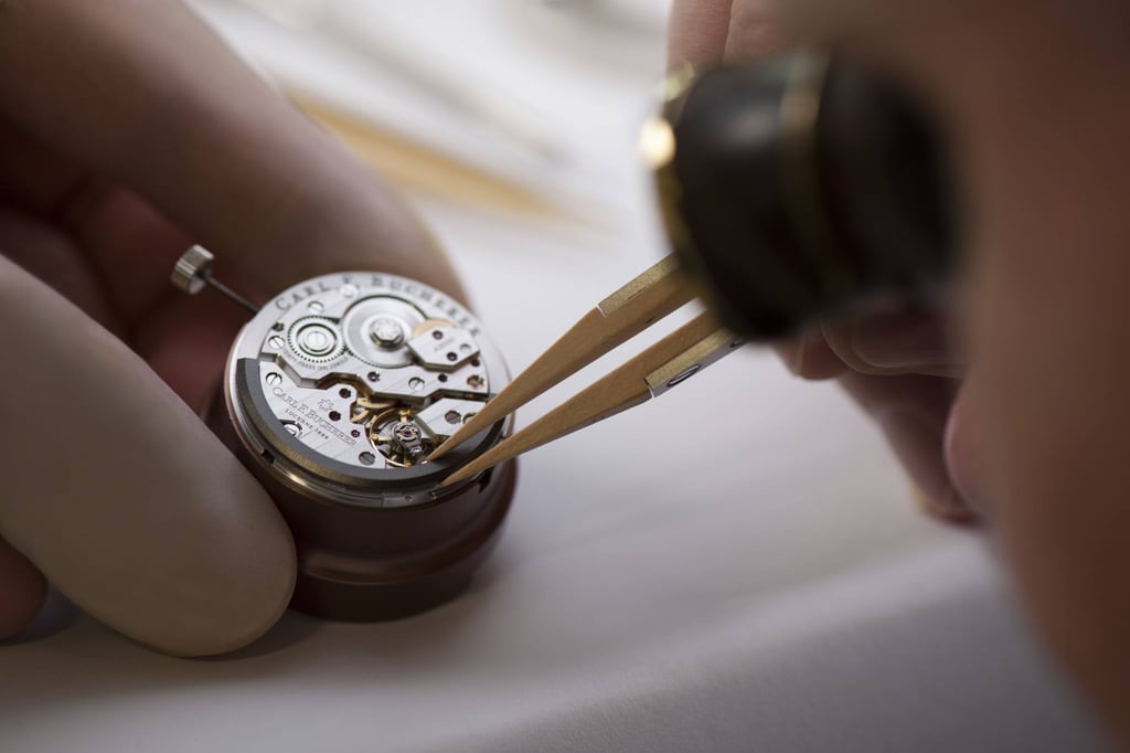 A watchmaker adds a peripheral rotor to a Carl F. Bucherer movement, which helps charge the power reserve without obscuring the movement as with traditional rotors A watchmaker adds a peripheral rotor to a Carl F. Bucherer movement, which helps charge the power reserve without obscuring the movement as with traditional rotors