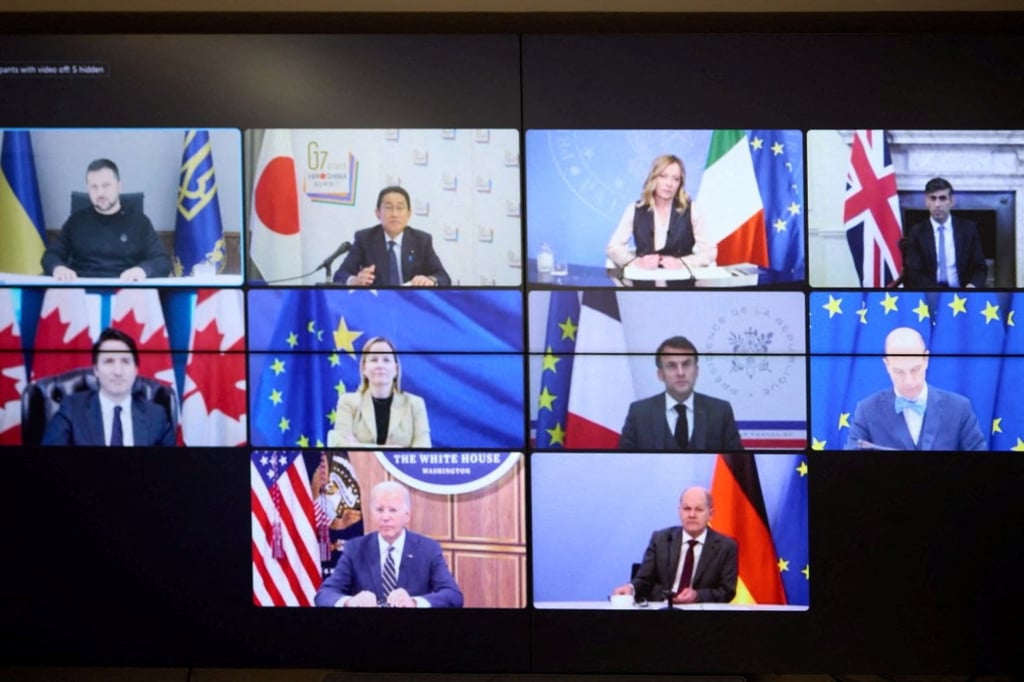 The G7 summit leaders appear on a monitor during a video conference with Ukrainian President Volodymyr Zelensky on Wednesday. Photo: Handout via Reuters The G7 summit leaders appear on a monitor during a video conference with Ukrainian President Volodymyr Zelensky on Wednesday. Photo: Handout via Reuters