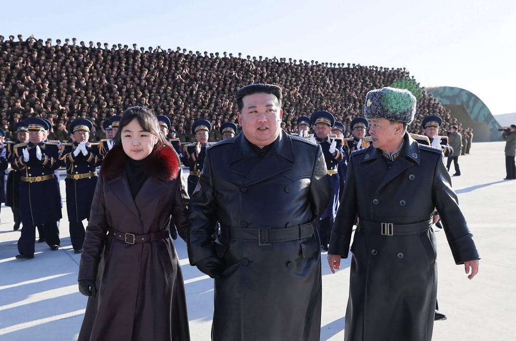 Kim Jong-un (centre) and his daughter (left) visit the 1st Air Force Division Flying Regiment of the Korean People’s Army to commemorate “Aviation Day” on November 30. Photo: KCNA via KNS/AFP Kim Jong-un (centre) and his daughter (left) visit the 1st Air Force Division Flying Regiment of the Korean People’s Army to commemorate “Aviation Day” on November 30. Photo: KCNA via KNS/AFP