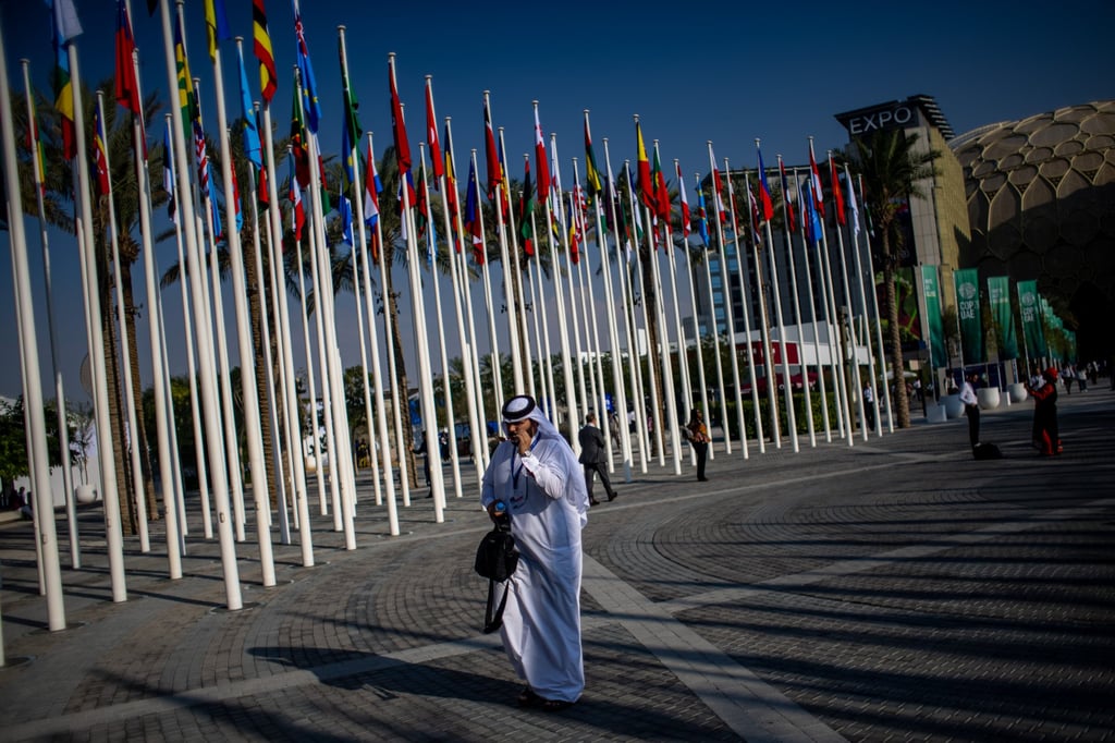 A participant walks at Expo City Dubai, the venue of the Cop28 summit. Leaders at Cop28 should not shy away from discussing the reality that governments and businesses have engaged in a charade to date. Photo: EPA-EFE A participant walks at Expo City Dubai, the venue of the Cop28 summit. Leaders at Cop28 should not shy away from discussing the reality that governments and businesses have engaged in a charade to date. Photo: EPA-EFE