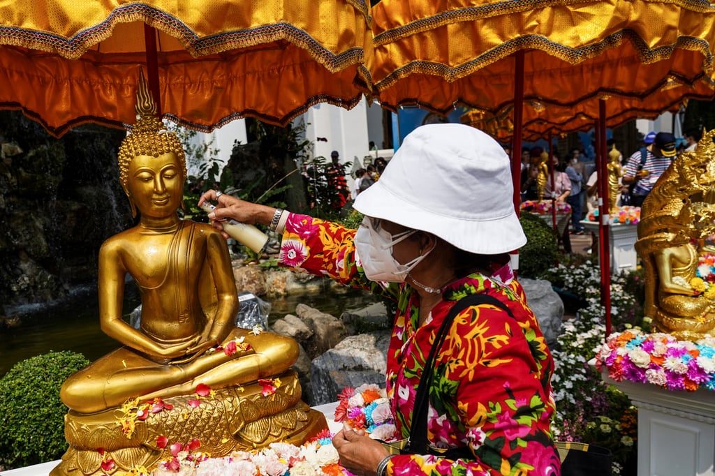 A Thai woman during Songkran celebrations at Wat Pho temple in Bangkok, Thailand, April 2023. Photo: Getty Images