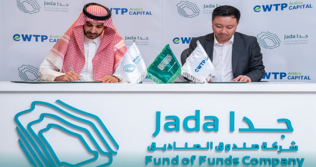 Bandr Alhomaly, CEO of Jada Fund of Funds (left), and Jerry Li, eWTPA founder and managing partner sign the investment agreement in Riyadh, Saudi Arabia on December 7, 2023. Photo: Jada