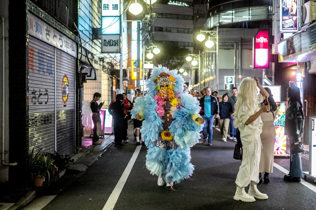 Costumed partygoers in Ni-chome district. Ni-chome, made up of some 400 mainly small bars packed into roughly five city blocks, is often cited as the world’s densest concentration of gay and lesbian bars. Photo: AFP Costumed partygoers in Ni-chome district. Ni-chome, made up of some 400 mainly small bars packed into roughly five city blocks, is often cited as the world’s densest concentration of gay and lesbian bars. Photo: AFP