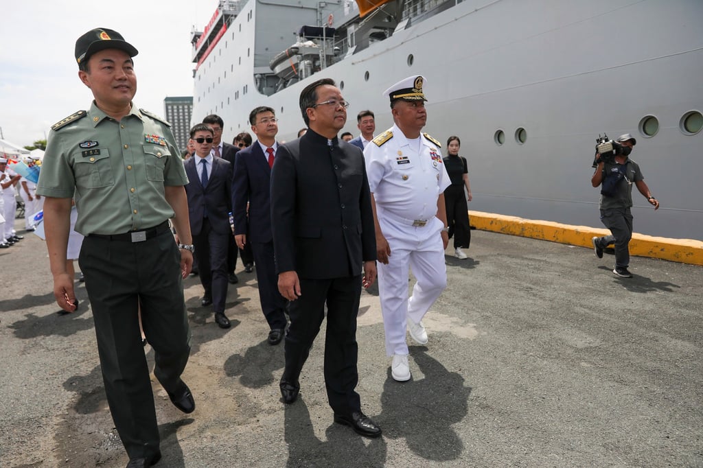 Chinese Ambassador to the Philippines Huang Xilian (centre) welcomes the arrival of a Chinese naval training ship for a goodwill visit at Manila’s port in June. Photo: AP Chinese Ambassador to the Philippines Huang Xilian (centre) welcomes the arrival of a Chinese naval training ship for a goodwill visit at Manila’s port in June. Photo: AP