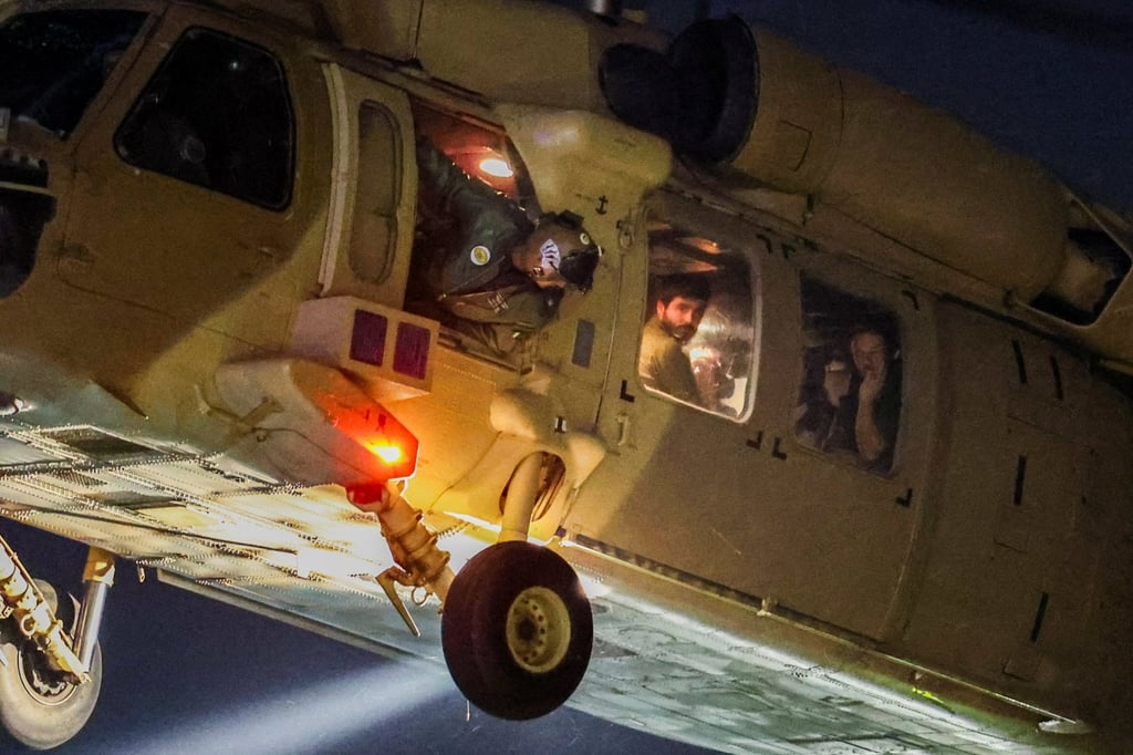 A helicopter carrying hostages who were freed during the recent brief truce. Photo: Reuters