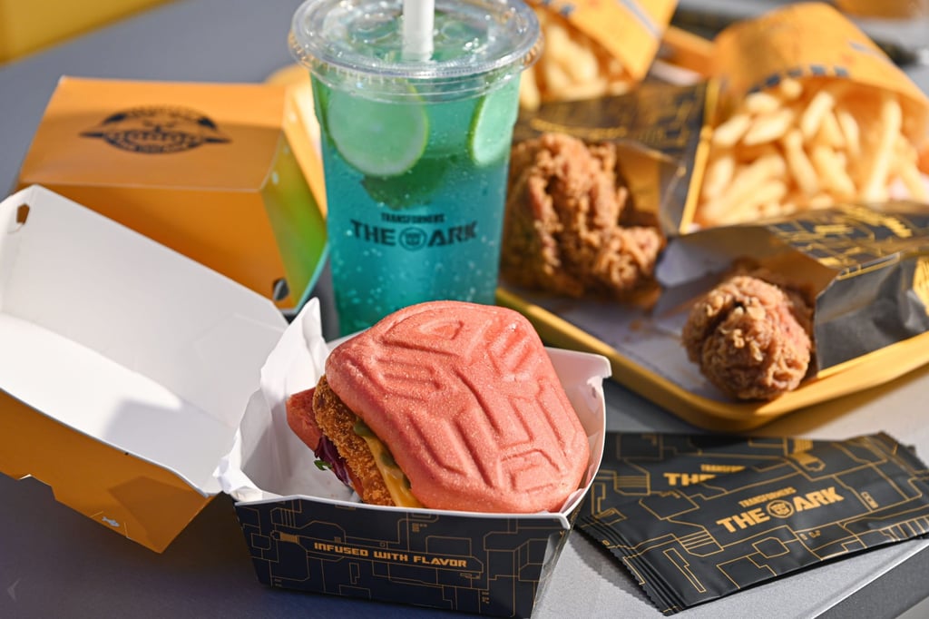 Crabmeat avocado burger with drink, fried chicken and chips. Photo: Transformers: The Ark